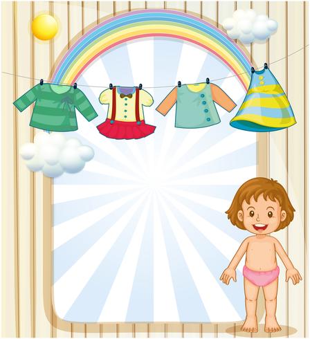 Een baby onder de hangende kleding vector