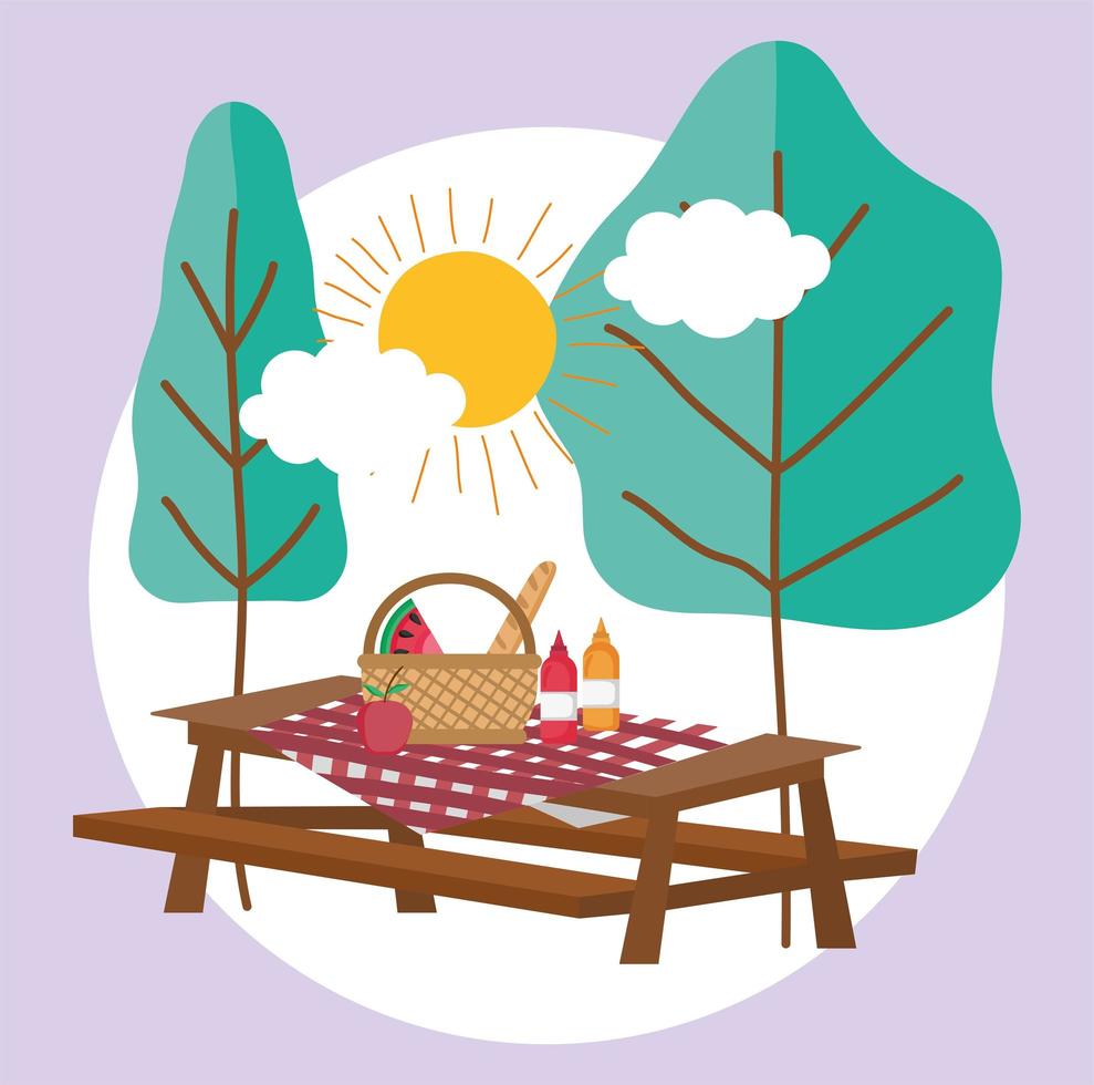 tafel met mand en eten picknick in het park vector