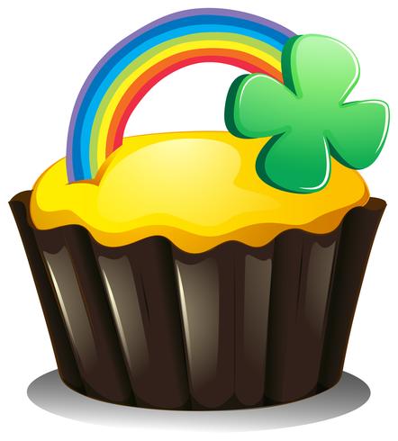 Een cupcake met een regenboog en een plant vector