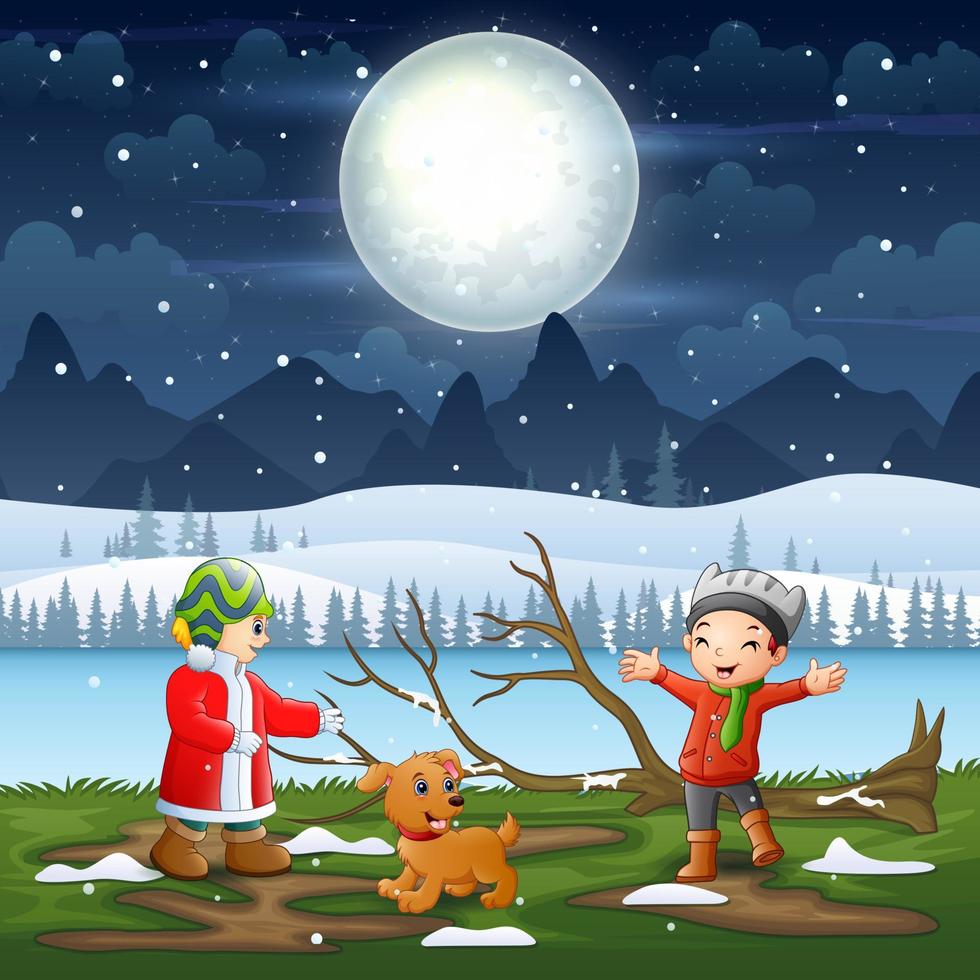 kinderen spelen in het winternachtlandschap vector