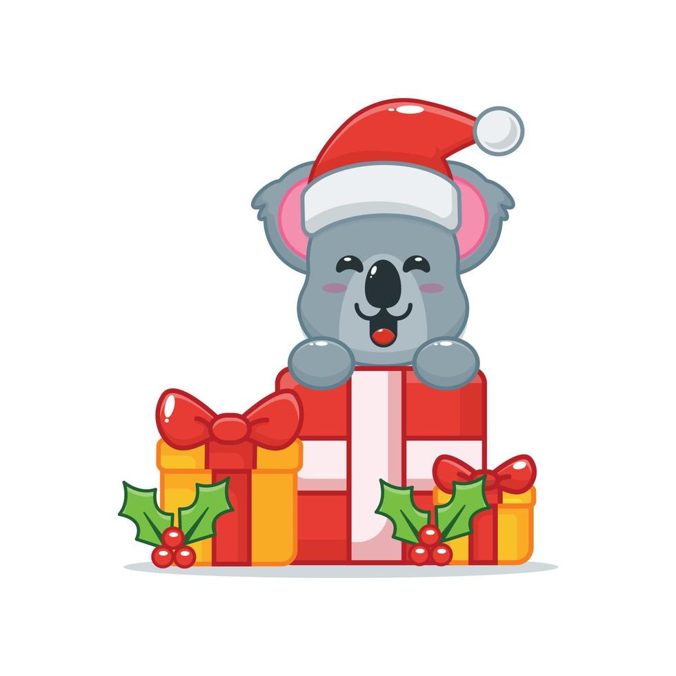 schattig koala stripfiguur met kerstcadeau vector