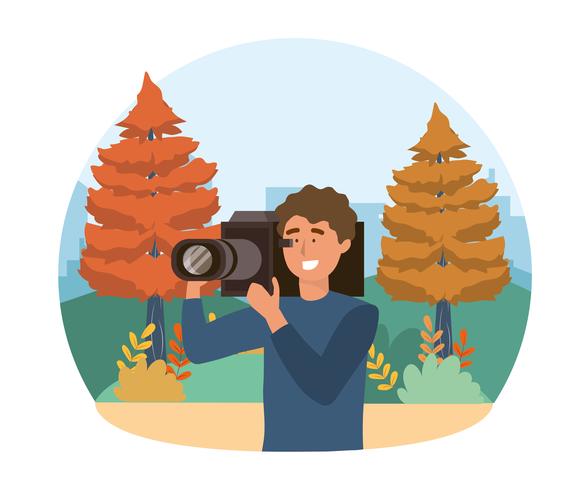 Cameraman in park met pijnbomen vector