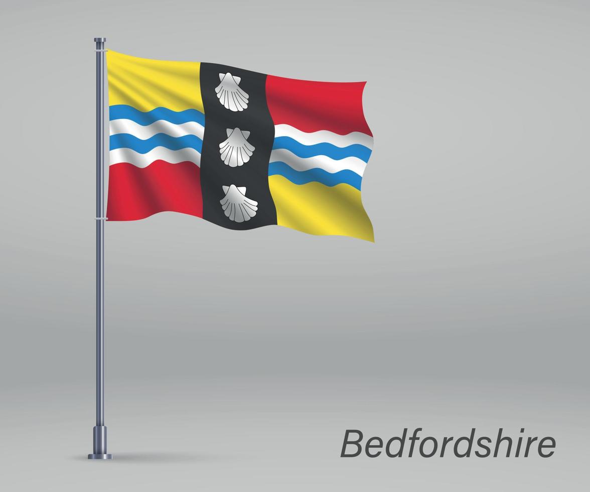 wapperende vlag van bedfordshire - graafschap engeland op vlaggenmast. vector