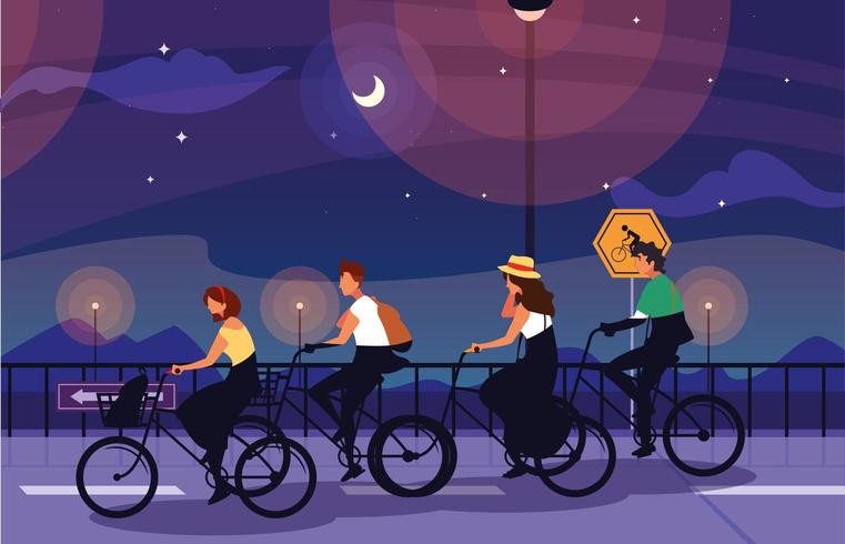 mensen rijden fiets in de nacht vector