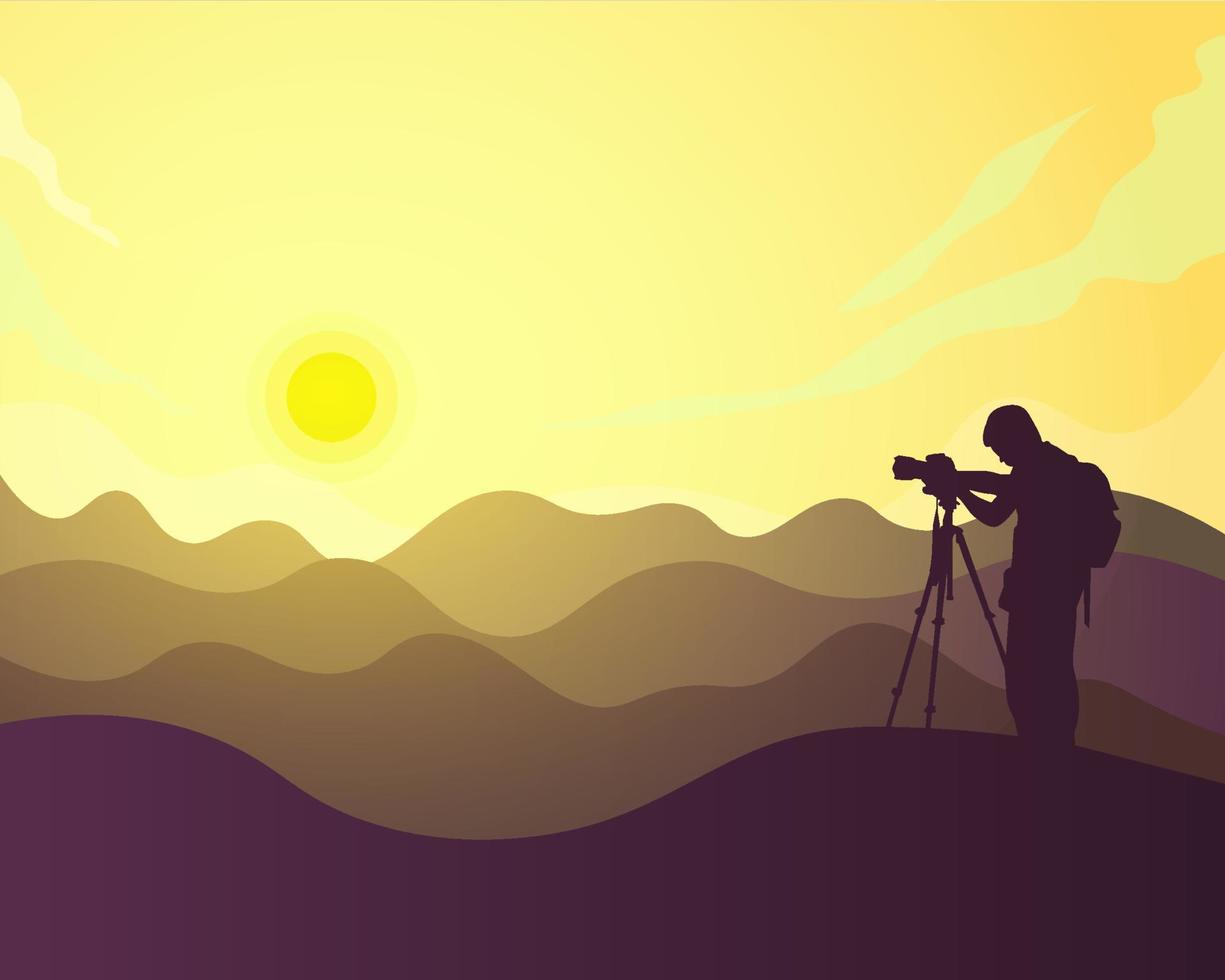 silhouetfotograaf op de heuvel die foto's maakt van zonsondergang en bergen vector