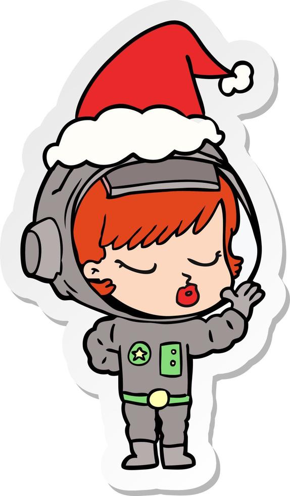 sticker cartoon van een mooi astronautenmeisje met een kerstmuts vector