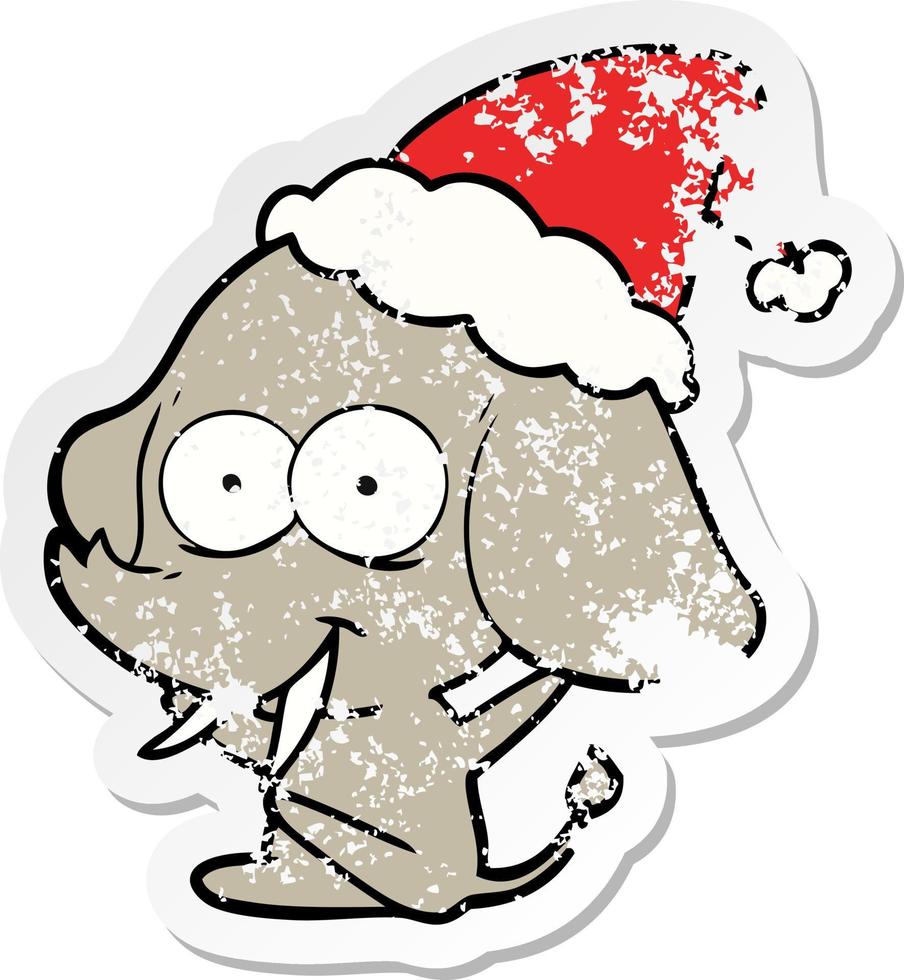 vrolijke, verontruste stickercartoon van een olifant met een kerstmuts vector