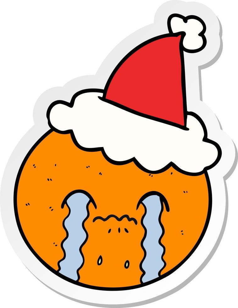 sticker cartoon van een sinaasappel met een kerstmuts vector