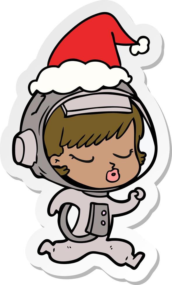 sticker cartoon van een mooi astronautenmeisje dat rent met een kerstmuts vector