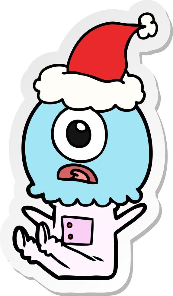 sticker cartoon van een cyclops buitenaardse ruimtevaarder met een kerstmuts vector