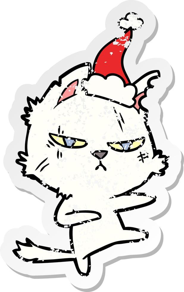 stoere, verontruste stickercartoon van een kat met een kerstmuts vector