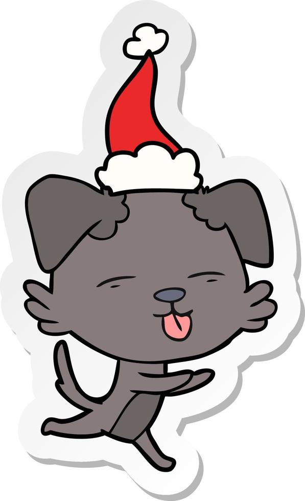 sticker cartoon van een hond die zijn tong uitsteekt met een kerstmuts vector