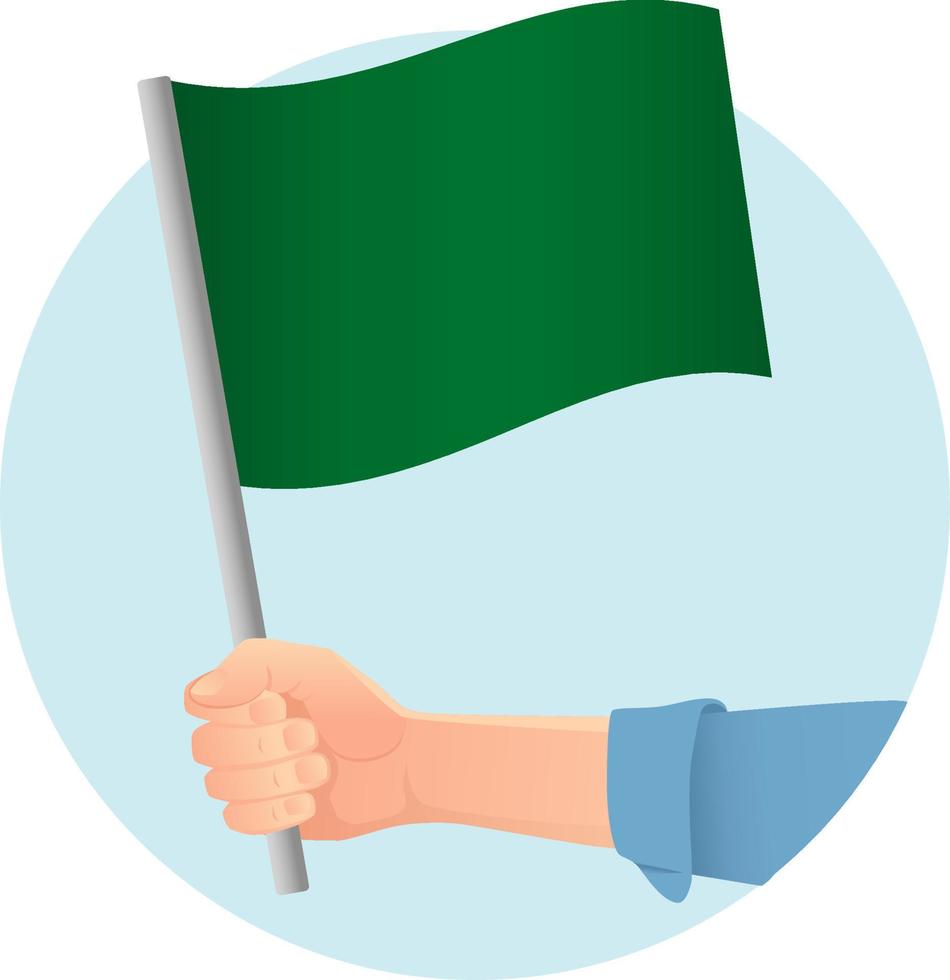 groene vlag in de hand vector