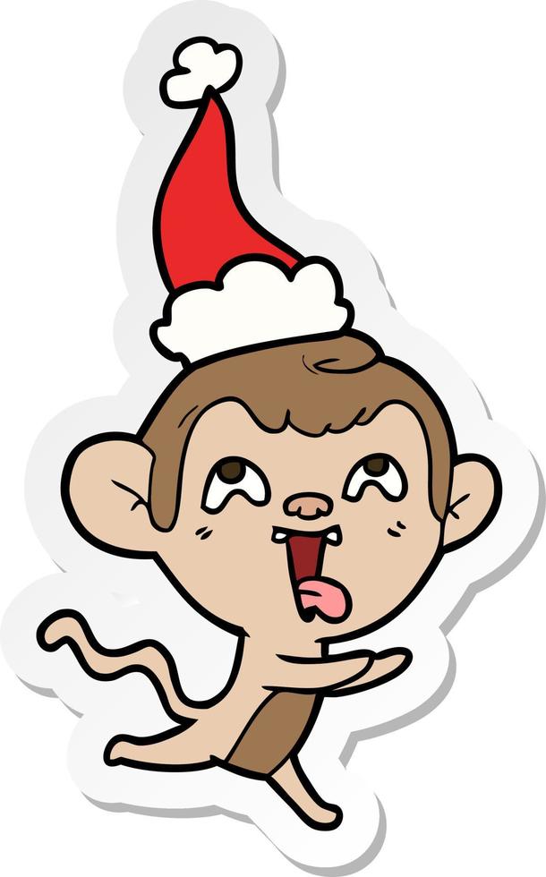 gekke sticker cartoon van een aap die rent met een kerstmuts vector