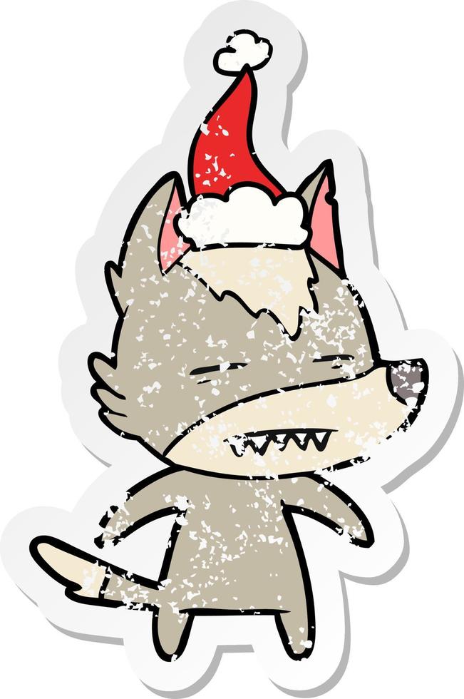 verontruste sticker cartoon van een wolf met tanden die een kerstmuts dragen vector