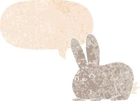 cartoon konijn en tekstballon in retro getextureerde stijl vector