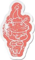 vriendelijke cartoon verontruste sticker van een ruimtevaarder met een kerstmuts vector
