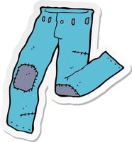 sticker van een cartoon opgelapte oude spijkerbroek