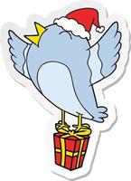 sticker cartoon van een vogel met een kerstmuts vector