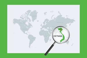 kaart van vietnam op politieke wereldkaart met vergrootglas vector
