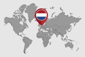 speldkaart met nederlandse vlag op wereldkaart. vectorillustratie.