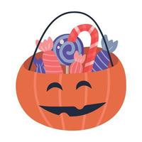 halloween pompoenmand vol snoep en snoep vector