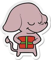 sticker van een cartoon lachende olifant met cadeau vector