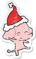 schattige, verontruste stickercartoon van een dansende olifant met een kerstmuts op vector