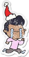 verontruste sticker cartoon van een huilende man met een kerstmuts vector