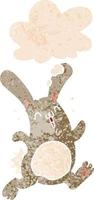 cartoon konijn en gedachte bel in retro getextureerde stijl vector
