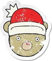 retro verontrust sticker van een tekenfilm teddy beer vervelend Kerstmis hoed vector