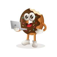 schattig donut mascotte werken gebruik makend van een laptop vector