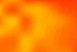 licht oranje vector wazig glans abstracte achtergrond.