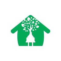 groen energie elektriciteit logo concept. elektrisch plug icoon met boom en huis. vector