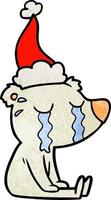 getextureerde tekenfilm van een huilen zittend polair beer vervelend de kerstman hoed vector