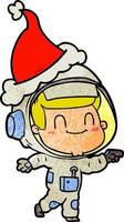 vrolijke getextureerde cartoon van een astronaut die een kerstmuts draagt vector