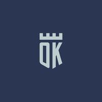 OK logo monogram met vesting kasteel en schild stijl ontwerp vector