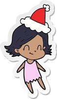 sticker cartoon van een vriendelijk meisje met een kerstmuts vector