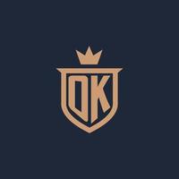 OK monogram eerste logo met schild en kroon stijl vector