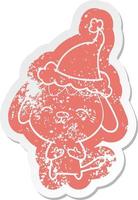 happy cartoon noodlijdende sticker van een hond met een kerstmuts vector