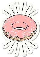 versleten oud sticker van een tatoeëren stijl bevroren donut vector