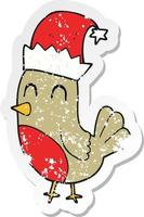 retro noodlijdende sticker van een cartoon kerst roodborstje vector