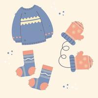 winter kleren. trui, wanten, handschoenen, sokken in blauw en beige vector