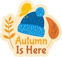 herfst is hier. leuke badge met gebreide muts vector