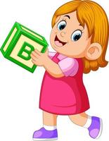 gelukkig meisje Holding de alfabet kubus vector