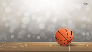 basketbal op rechtbankgebied met licht wazig bokeh vector