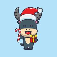 schattig buffel Holding Kerstmis snoep en geschenk. schattig Kerstmis tekenfilm illustratie. vector