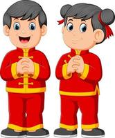 twee kinderen zijn geven een groet voor een Chinees nieuw jaar vector