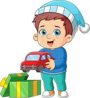 de jongen is hebben een nieuw auto speelgoed- van de de kerstman geschenk vector