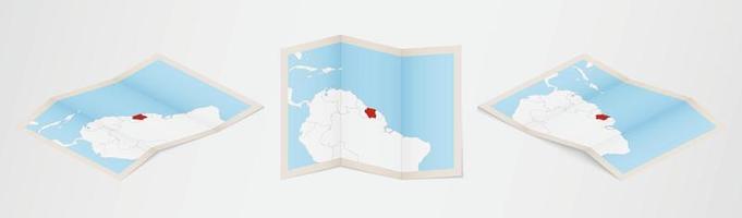gevouwen kaart van Suriname in drie verschillend versies. vector